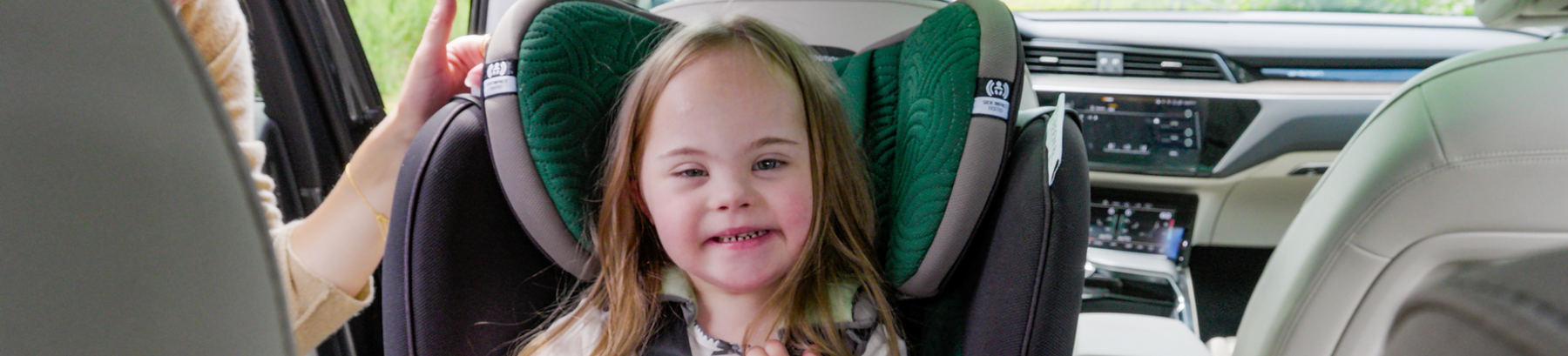 Evenflo Revolve360 car seat in green fabric, designed for gentle comfort and safety for infants and toddlers